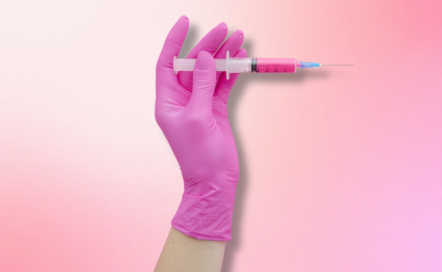 Hand holding a container of GLP-1 medication