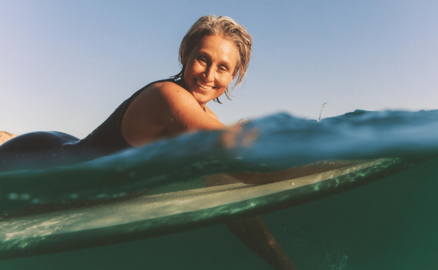 hers woman on surfboard