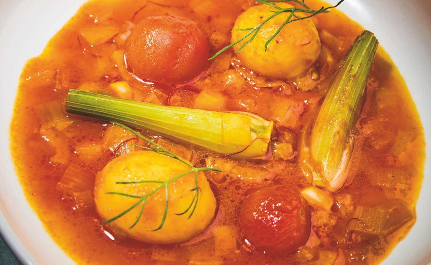 A bowl of vegetable bouillabaisse.